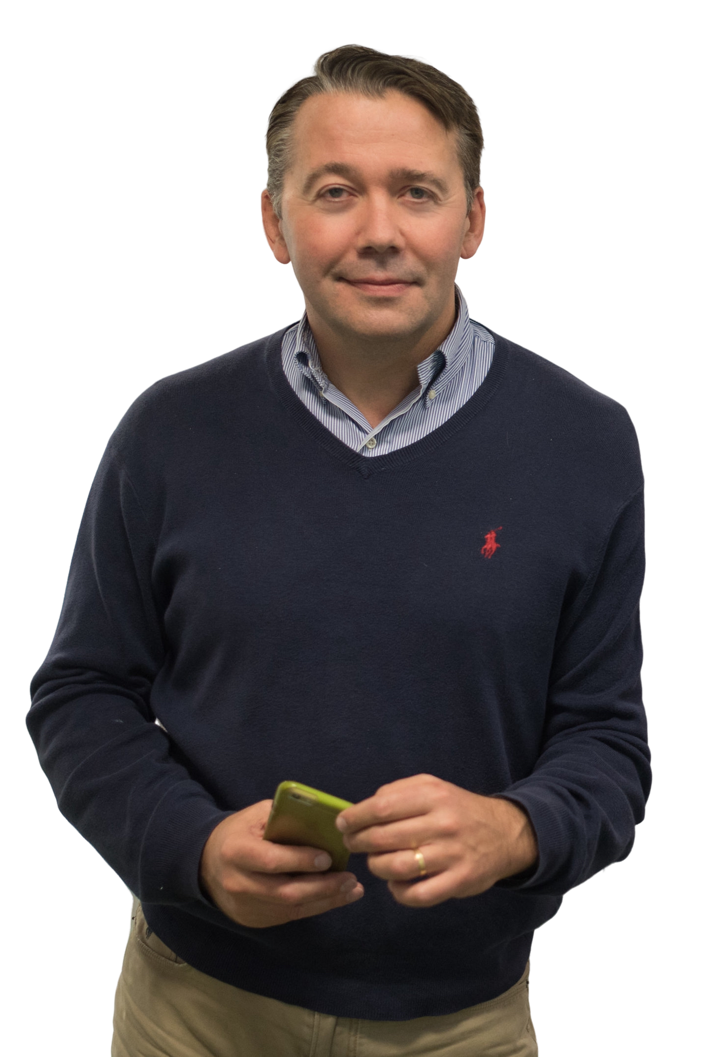 A man in a blue sweater holding a green cell phone.